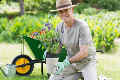 Gardening crew working responsibly with tools on a maintained lawn